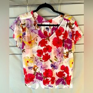 Cabi Passion Top in size Medium.